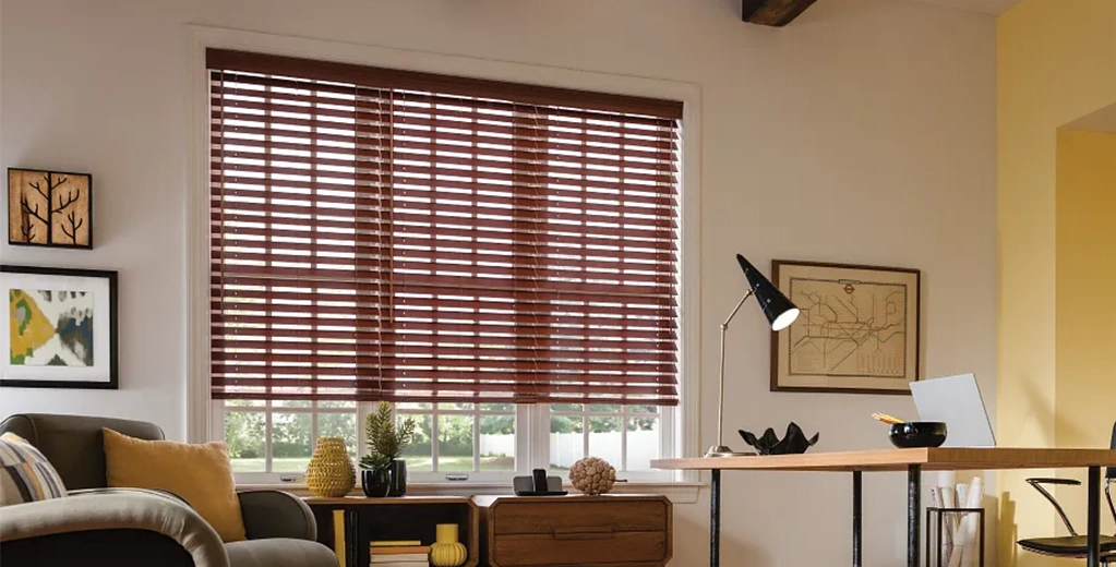 Woman in front of blinds