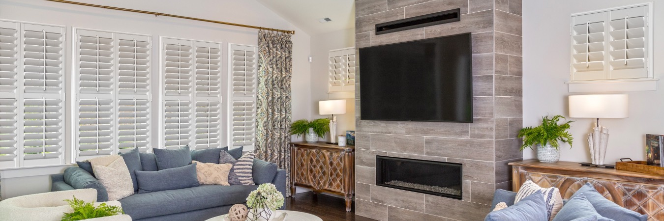 Plantation shutters in Canyon Gate living room with fireplace