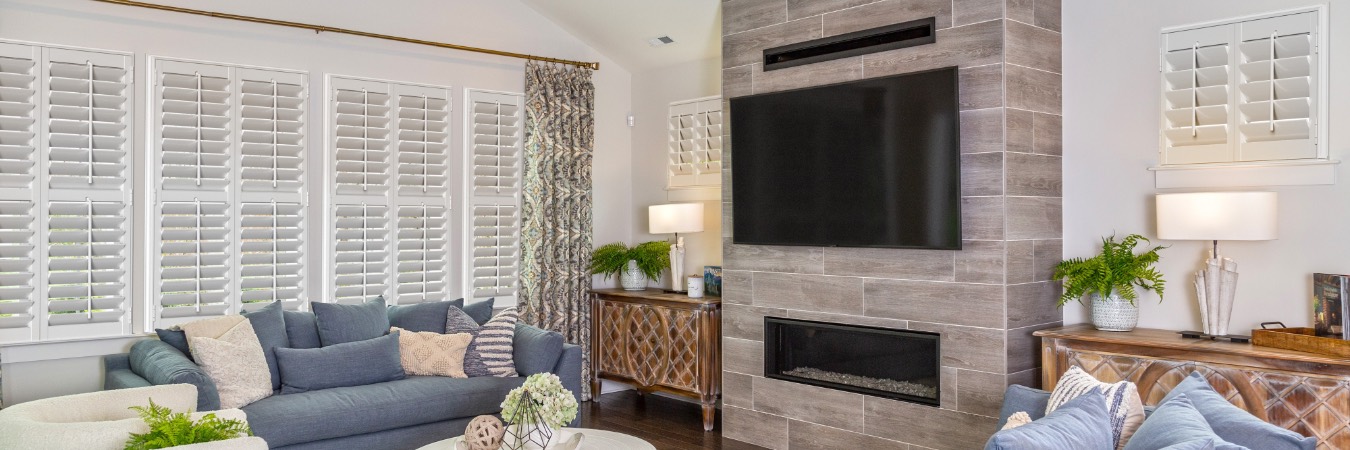 Plantation shutters in Green Valley living room with fireplace