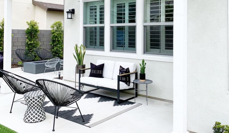 Spending a little time weeding and mulching can help give you an outdoor oasis. Backyard with plantation shutters