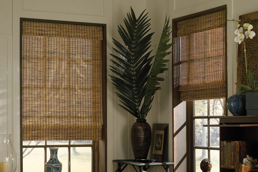 Bamboo brown style shades in a corner of a classic style living room.