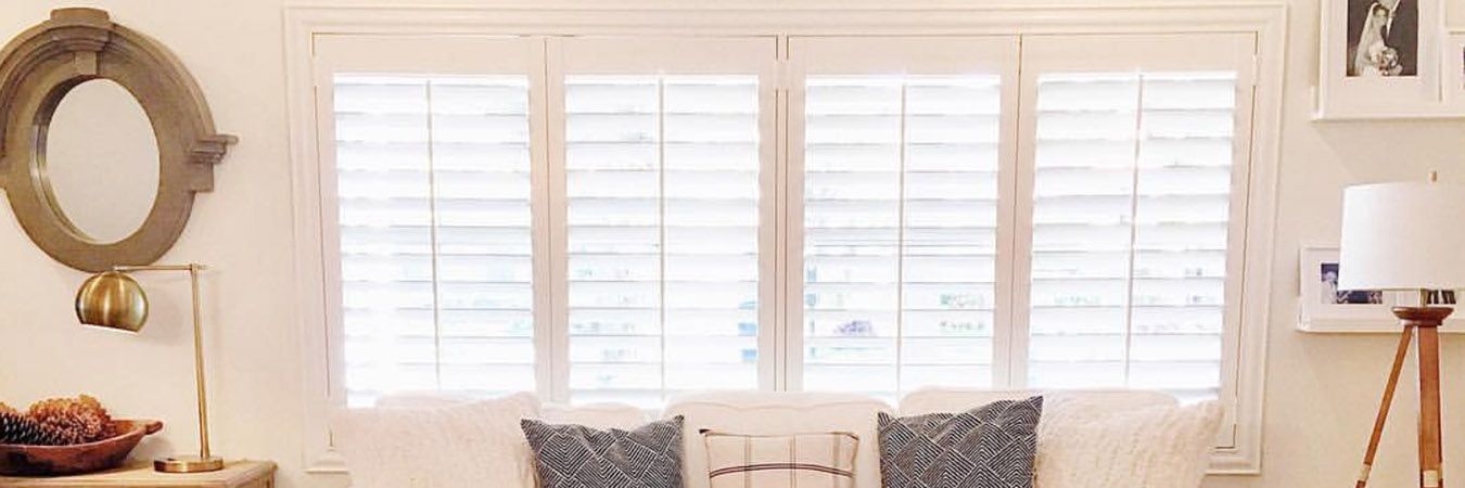 White shutters in a coastal style living room