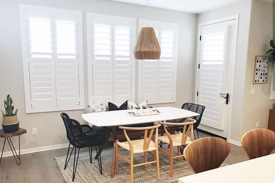 Use Polywood shutters to control natural light levels in your Las Vegas dining room. Polywood shutters with top louvers tilted open in a dining room