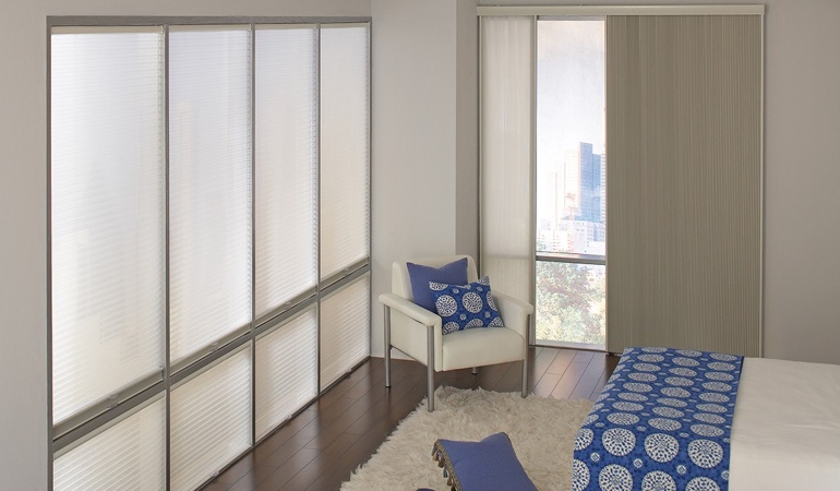 Cellular shades are another choice to reflect a minimalist design. Cellular shades in a streamlined bedroom.