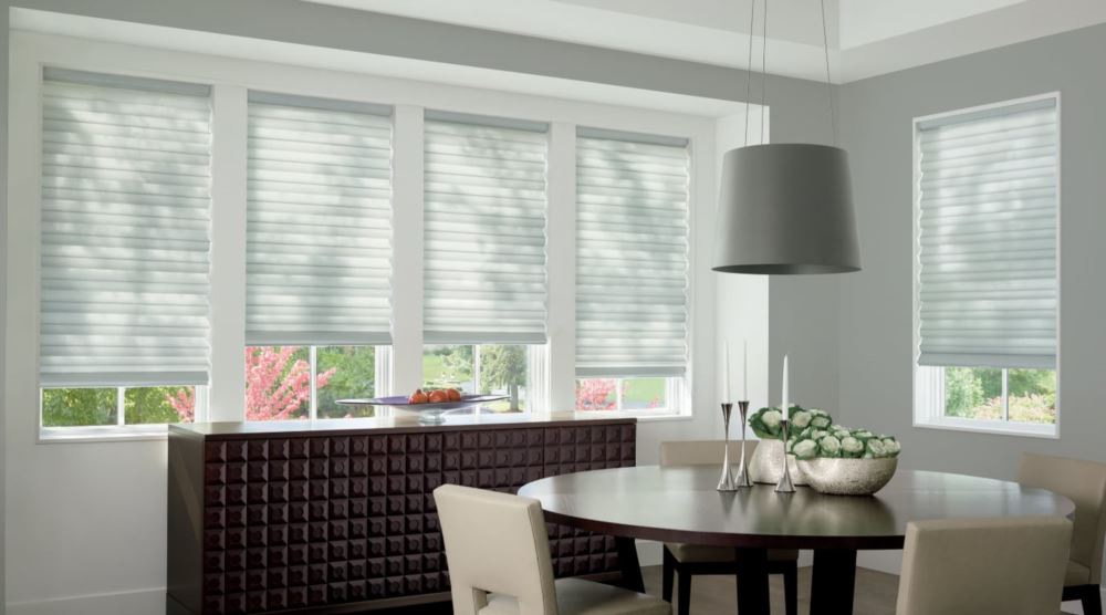 Custom cordless roller shades have a clean look and are appropriate for any room. Cordless motorized shades in a Las Vegas dining room