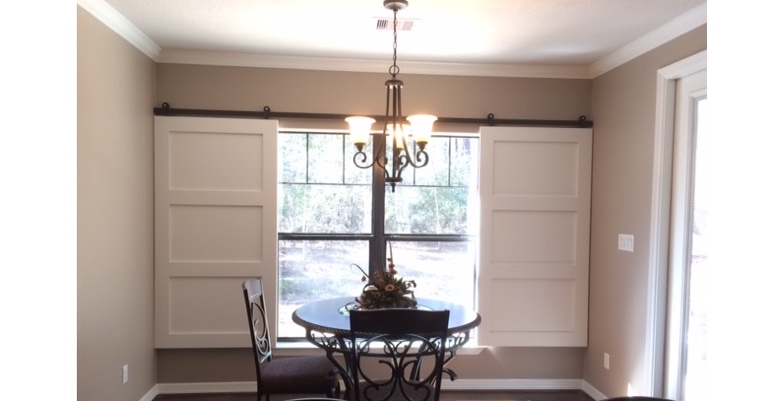 Barn doors open horizontally with slides instead of cords. Las Vegas barn door shutters