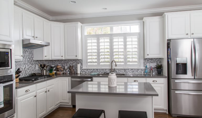 Polywood® plantation shutters resist heat and moisture in your kitchen. Polywood shutters in a Las Vegas gourmet kitchen.