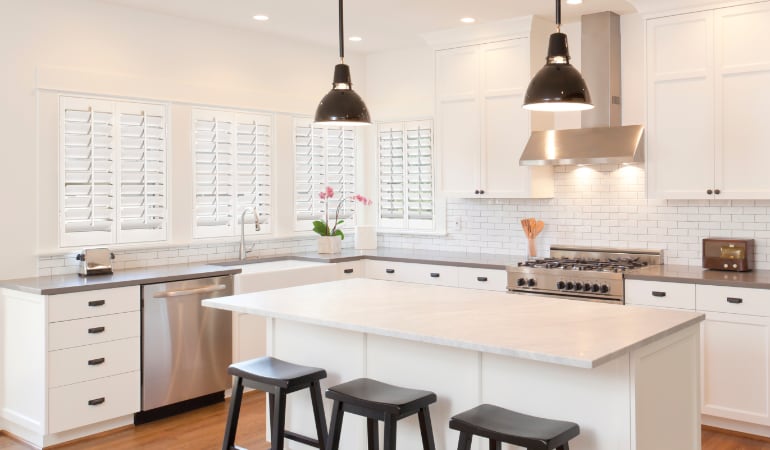 Plantation shutters let you control the amount of light in your kitchen. Plantation shutters in a bright Las Vegas kitchen.