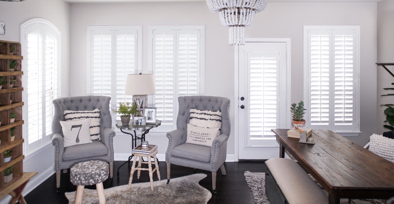Polywood shutters add a touch of luxury in addition to helping you lower your energy costs. Polywood shutters in a sitting room