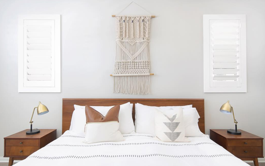 Custom-fitted louvered shutters provide excellent nighttime privacy in Las Vegas. Photo Credit: Audrey Crisp Louvered shutters in a bedroom.