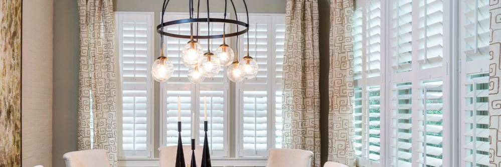 White polywood shutters in a dining room