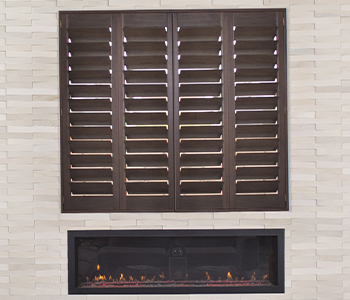 Ovation Shutters Ovation shutters above a modern fireplace