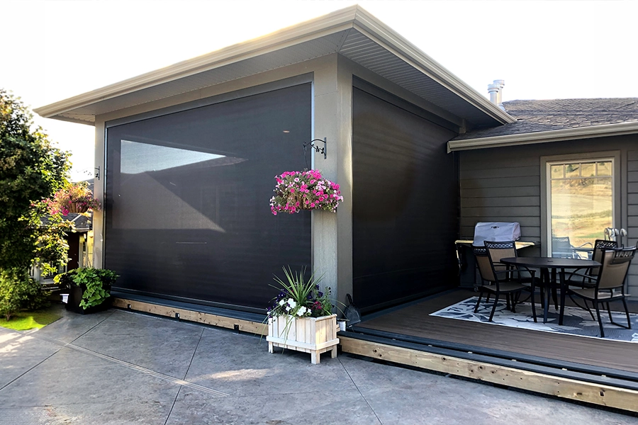A covered home patio enclosed with screen shades