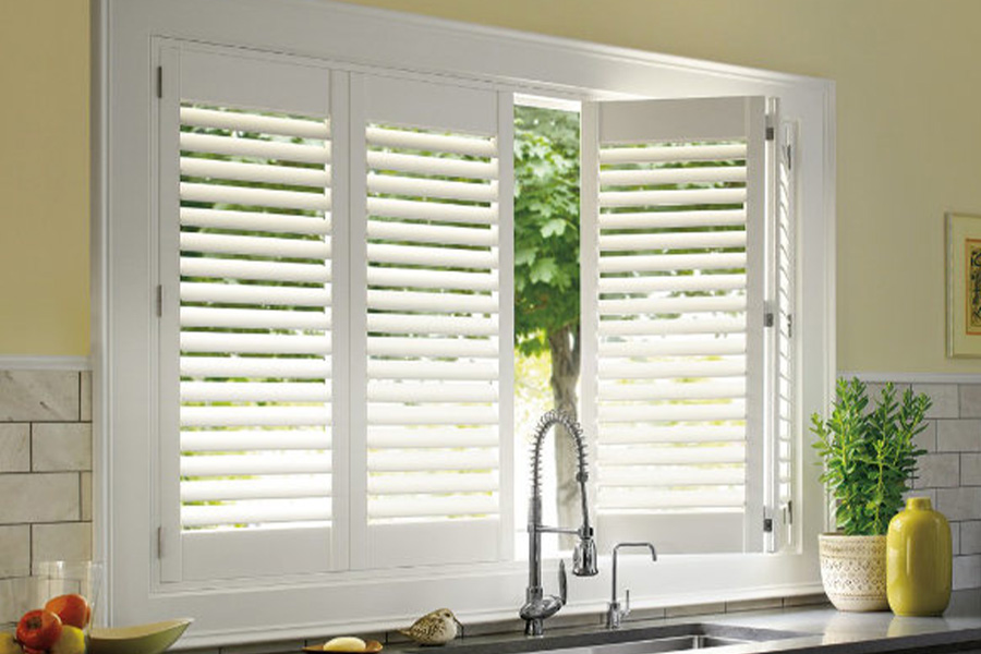Polywood shutters are built to withstand the test of time in Las Vegas. White Polywood shutters above a kitchen sink.